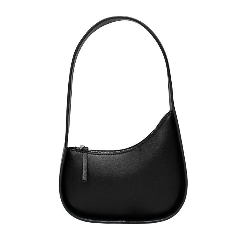 Leather Handbag with Assymetrical Saddle Design