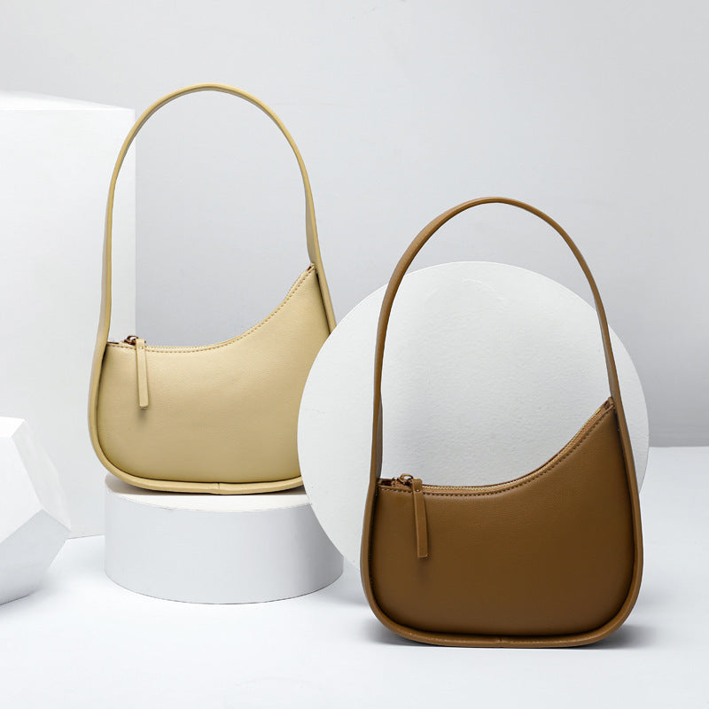 Leather Handbag with Assymetrical Saddle Design