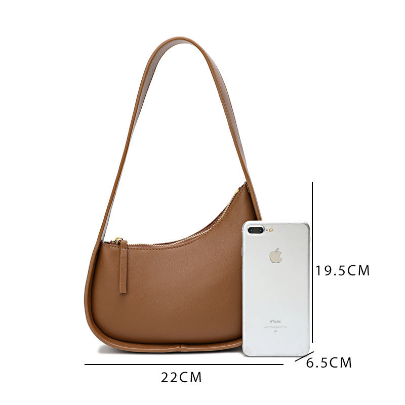 Leather Handbag with Assymetrical Saddle Design