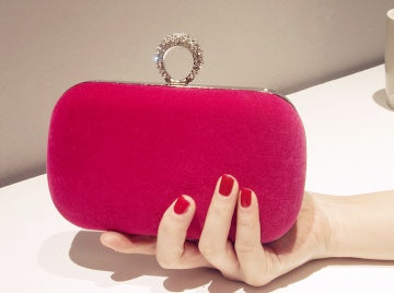 Sleek Suede Evening Bag with Ornate Clasp and Chain